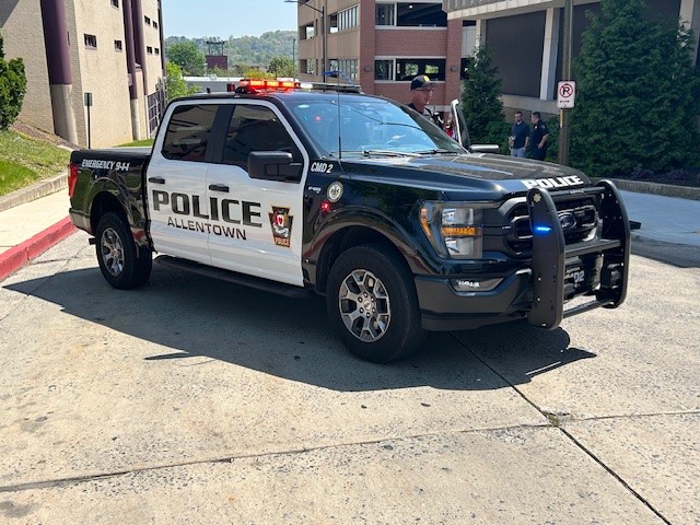 An APD truck parked outside City Hall.